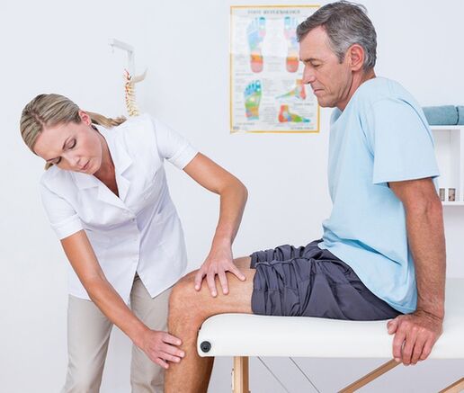 The doctor conducts a visual examination and palpation of a patient with knee pain
